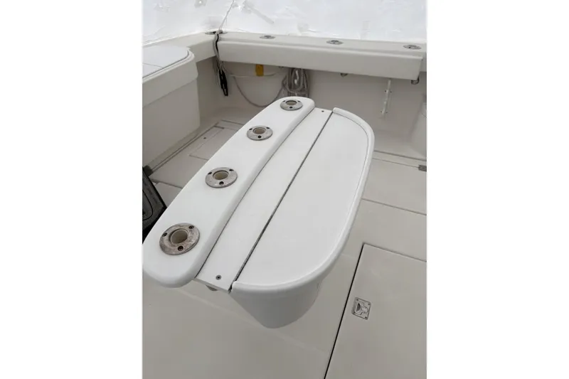 Slide: The Image of 2006 Rampage 38 Express boat dashboard with Icom VHF marine radio and Garmin display. - 13