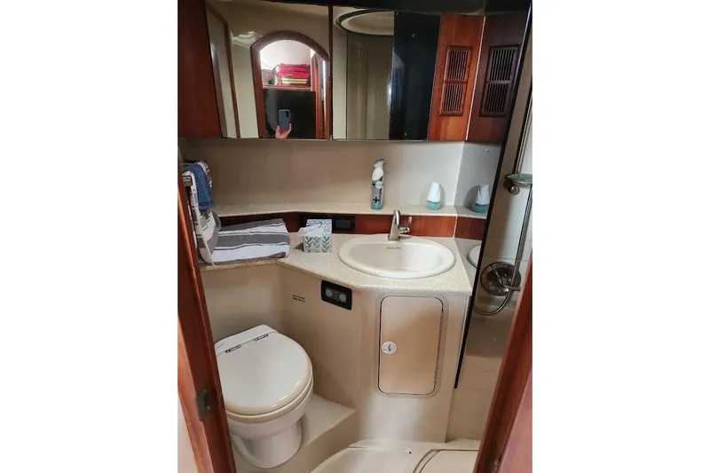 Slide: The Image of Bathroom interior of a 2006 Rampage 38 Express yacht, featuring sink and toilet. - 23