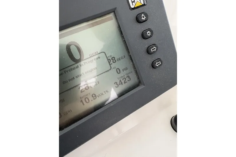 Slide: The Image of 2006 Rampage 38 Express boat cruising on open water at sunset. - 5