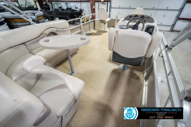 Slide: The Image of 2009 Sylvan 818 Mirage Fish boat interior with seating and steering console. - 14