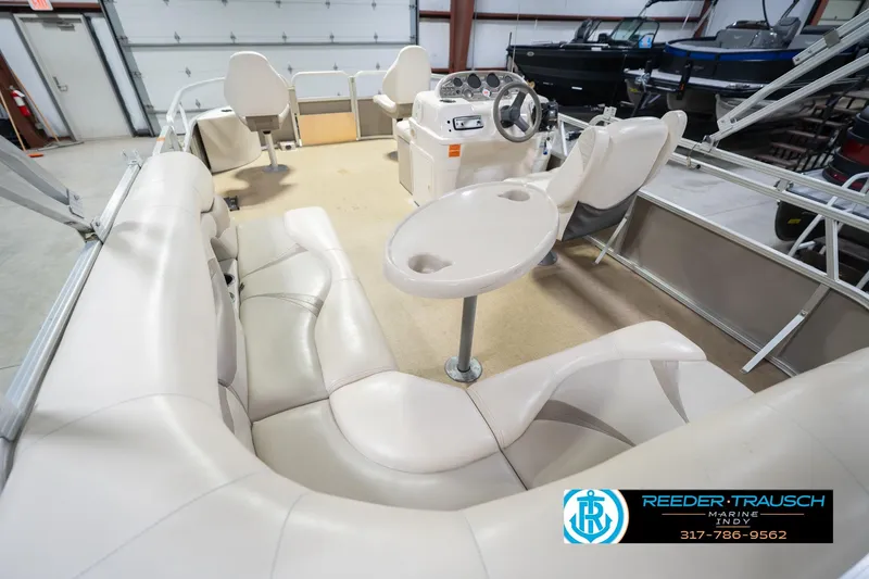 Slide: The Image of Interior of a 2009 Sylvan 818 Mirage Fish boat with beige seating and steering console. - 15
