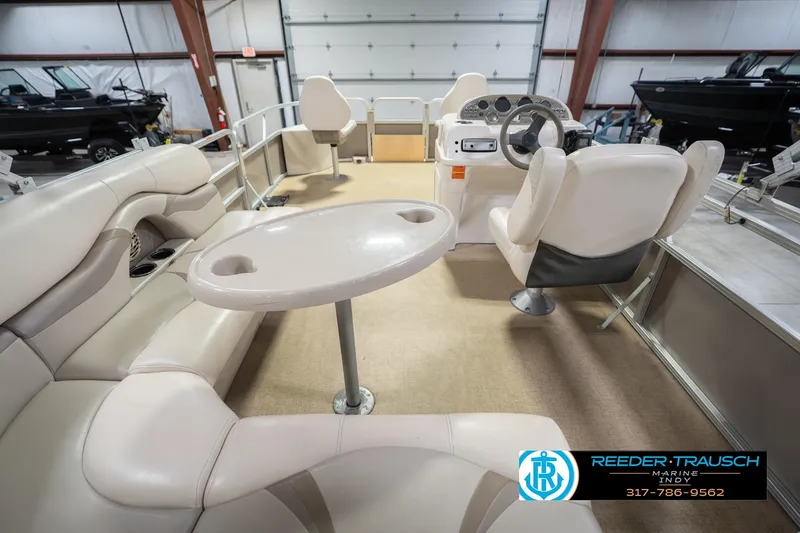 Slide: The Image of Interior of a 2009 Sylvan 818 Mirage Fish pontoon boat with seating and steering console. - 19