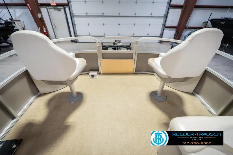 Slide: The Image of 2009 Sylvan 818 Mirage Fish boat interior with two swivel seats in a showroom. - 21
