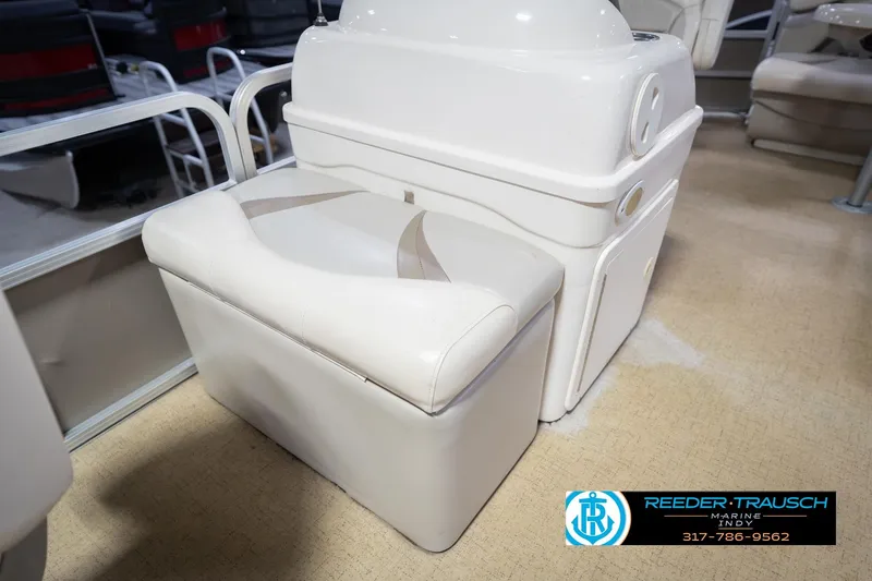 Slide: The Image of 2009 Sylvan 818 Mirage Fish boat interior with cushioned seating and storage. - 22