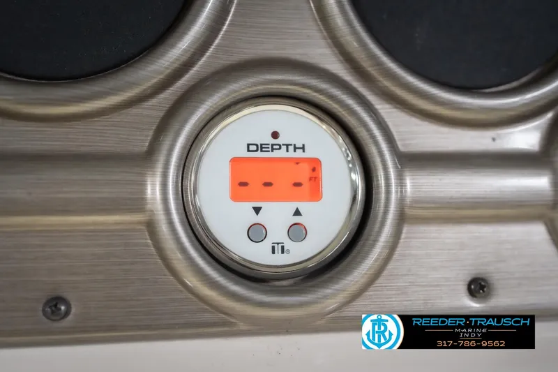 Slide: The Image of Depth gauge on 2009 Sylvan 818 Mirage Fish boat dashboard, Reeder-Trausch Marine logo visible. - 33
