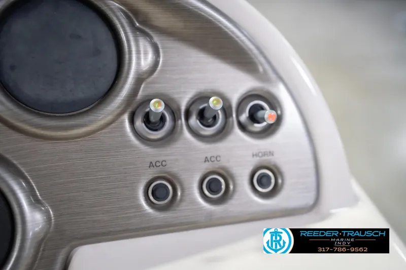 Slide: The Image of Dashboard controls of a 2009 Sylvan 818 Mirage Fish boat with switches and buttons. - 34