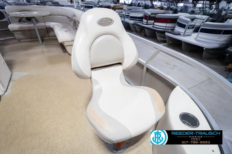 Slide: The Image of 2009 Sylvan 818 Mirage Fish boat seat in showroom, featuring beige upholstery. - 42