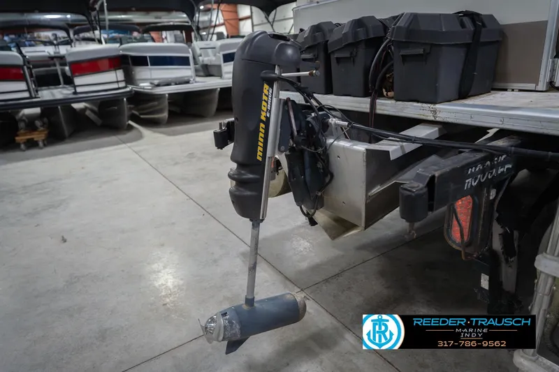 Slide: The Image of 2009 Sylvan 818 Mirage Fish boat with Minn Kota motor in a storage facility. - 46