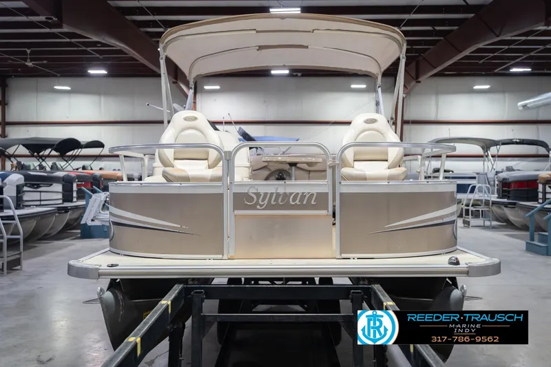 Slide: The Image of 2009 Sylvan 818 Mirage Fish pontoon boat in showroom, front view. - 5