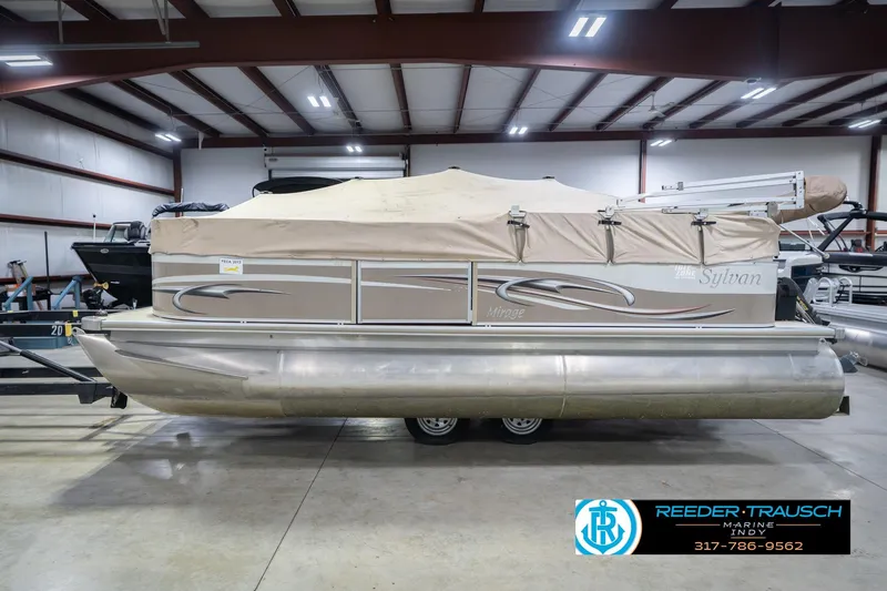 Slide: The Image of 2009 Sylvan 818 Mirage Fish pontoon boat in indoor storage facility. - 53