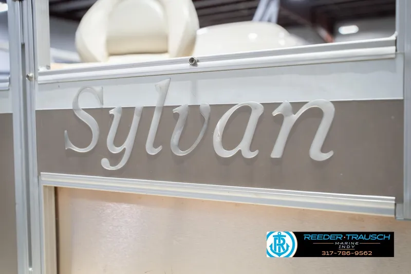 Slide: The Image of 2009 Sylvan 818 Mirage Fish boat, close-up of logo and seating, Reeder-Trausch Marine contact. - 54