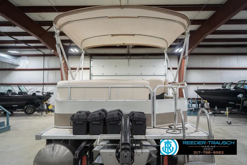 Slide: The Image of 2009 Sylvan 818 Mirage Fish pontoon boat in indoor storage facility. - 9