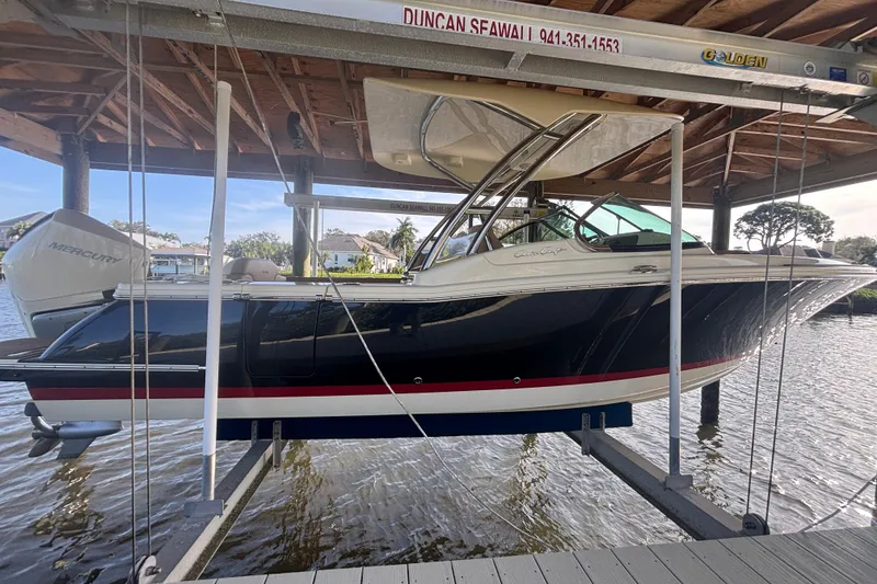 The Image of 2023 Chris-Craft Calypso 24 boat on lift, dockside view. - 0