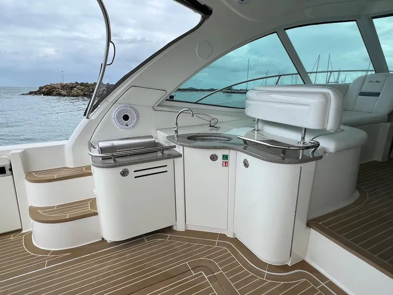 Slide: The Image of Interior of a 2006 Sea Ray 48 Sundancer yacht with modern amenities. - 26