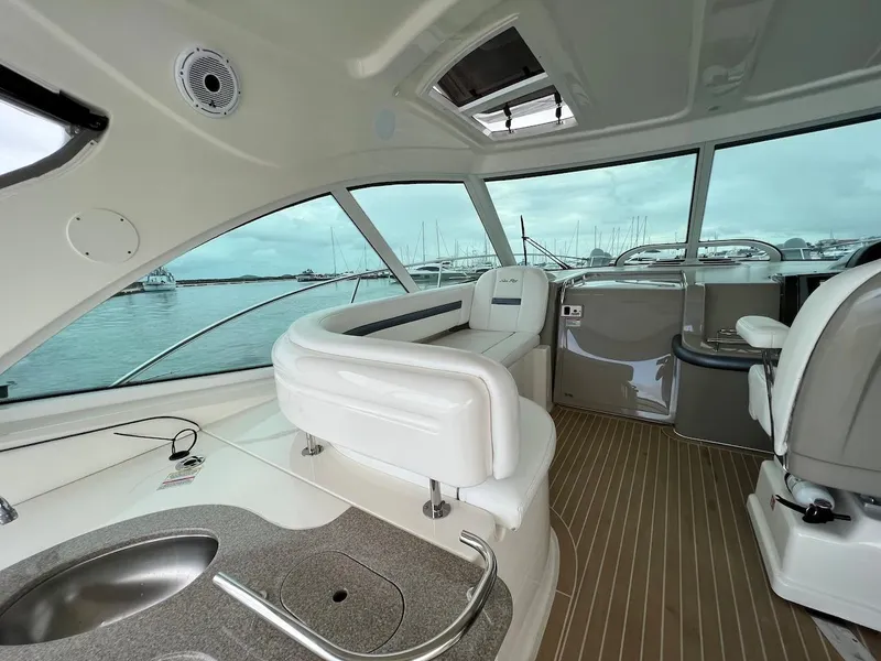 Slide: The Image of Interior of a 2006 Sea Ray 48 Sundancer yacht overlooking the harbor. - 31