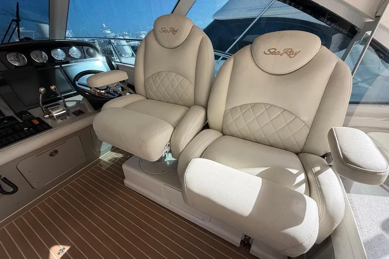 Slide: The Image of Luxurious helm seats on a 2006 Sea Ray 48 Sundancer yacht, featuring elegant design and comfort. - 34