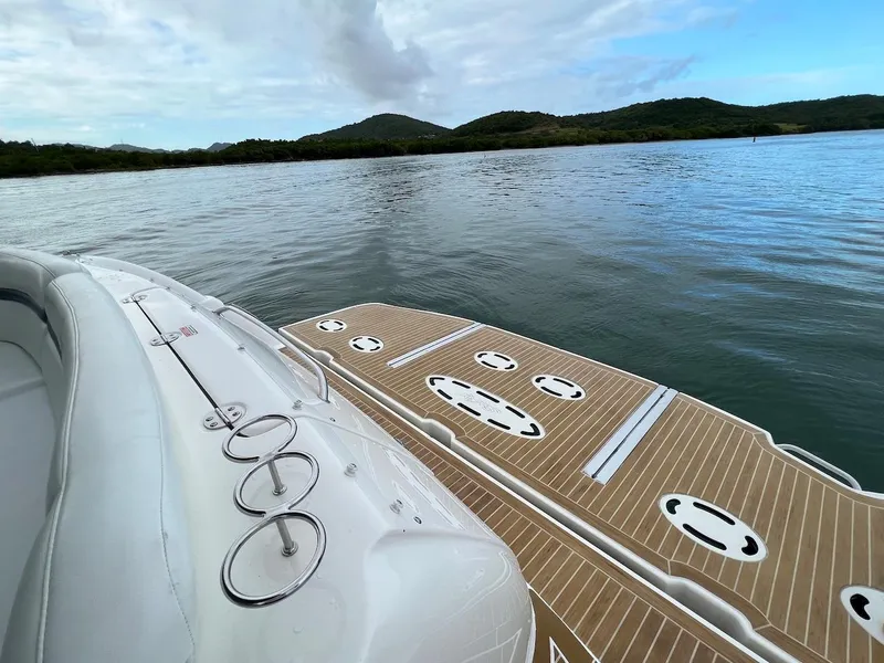 Slide: The Image of Sea Ray 48 Sundancer 2006 on calm water with cloudy sky. - 38