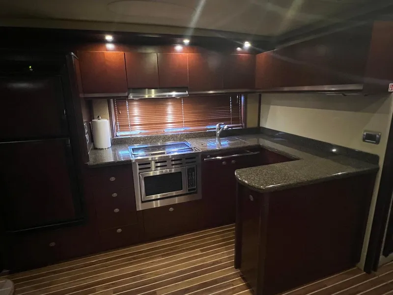 Slide: The Image of Kitchen of the 2006 Sea Ray 48 Sundancer yacht. - 48