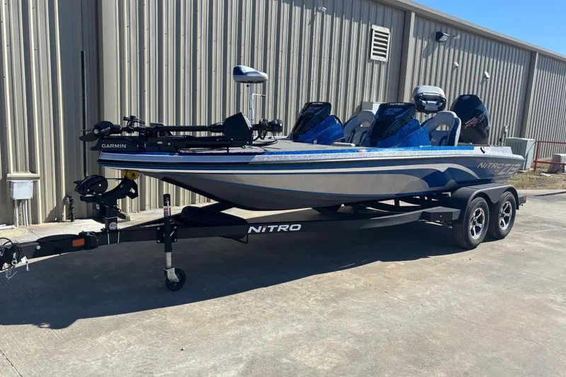 The Image of 2026 Nitro Z19 XL Pro fishing boat on trailer, parked outdoors. - 0