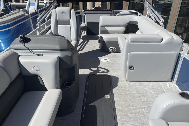 Slide: The Image of 2026 Sun Tracker SportFish 22 XP3 pontoon boat interior with gray seating and modern design. - 87