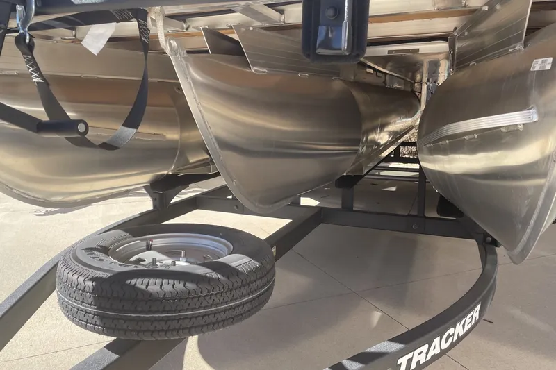 Slide: The Image of 2026 Sun Tracker SportFish 22 XP3 pontoon boat on trailer, underside view. - 89