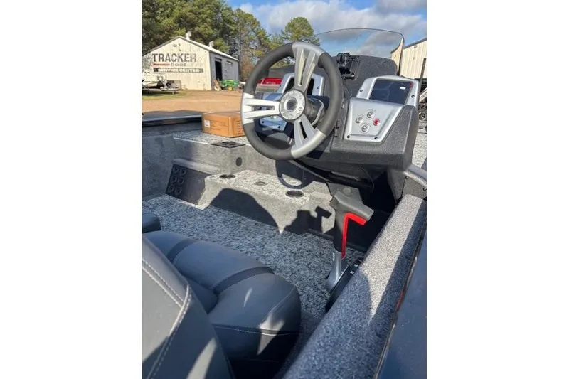 Slide: The Image of 2026 Tracker Pro Team 195 boat interior with steering wheel and dashboard controls. - 10