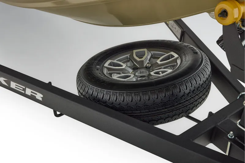 Slide: The Image of 2026 Tracker Pro Team 195 boat storage compartment with open lid, showcasing interior details. - 15