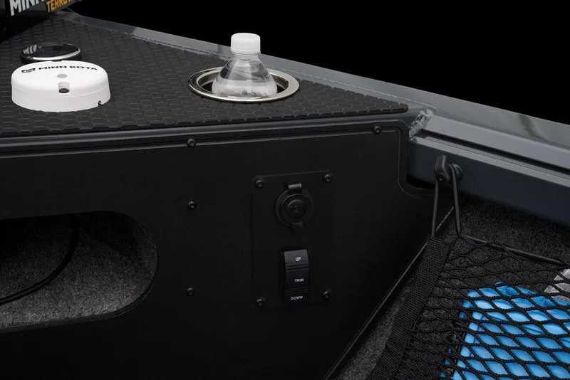 Slide: The Image of 2026 Ranger VS1882SC Reata boat storage compartment with rod holders and carpeted interior. - 29