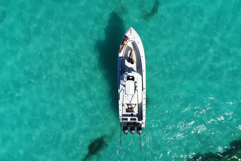 Slide: The Image of Aerial view of 2026 Contender 35 ST boat on clear turquoise water. - 7