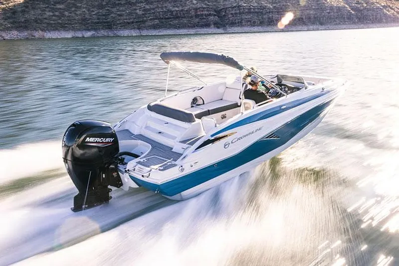 The Image of 2026 Crownline Eclipse E210 XS boat on trailer, parked outdoors. - 0