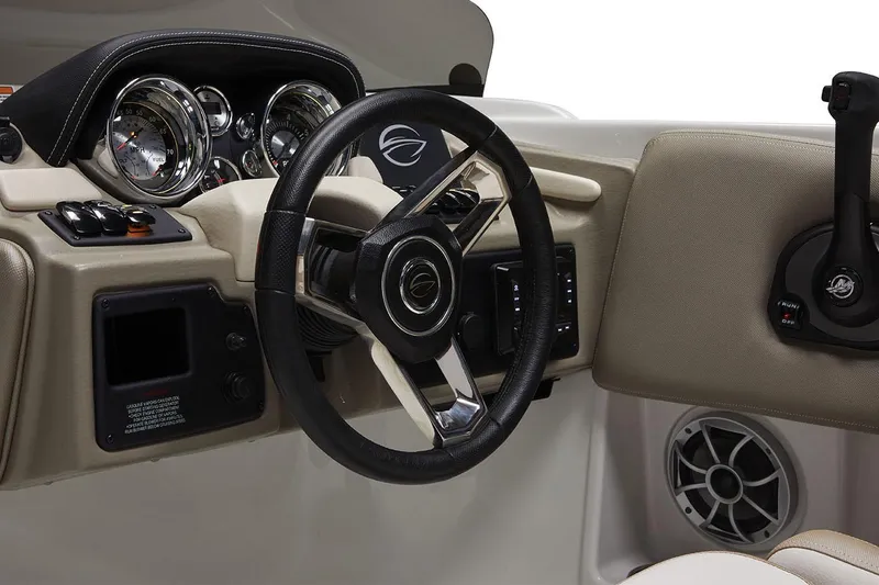 Slide: The Image of 2026 Crownline Eclipse E210 XS boat interior with blue and white seating, modern dashboard. - 2