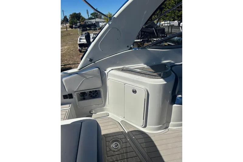 Slide: The Image of 2026 Crownline 280 CRX boat interior with sleek seating and storage compartments. - 17