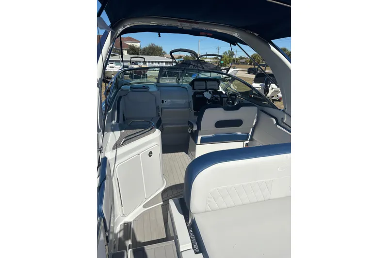 Slide: The Image of 2026 Crownline 280 CRX boat interior with modern dashboard and seating. - 18