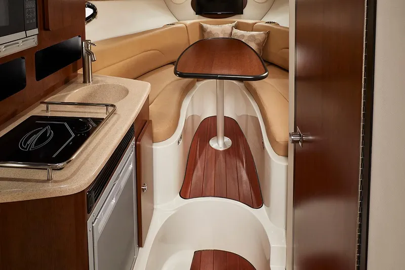 Slide: The Image of 2026 Crownline 280 CRX boat interior with seating and deck view. - 7