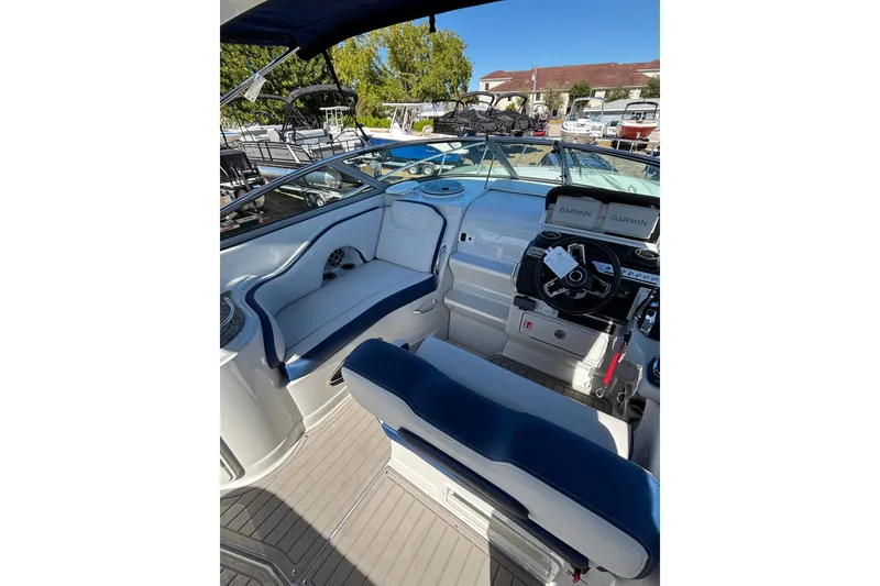 Slide: The Image of 2026 Crownline 280 CRX boat interior with modern helm and seating. - 9