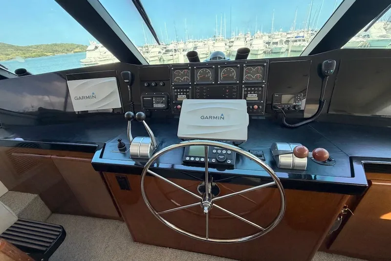 Slide: The Image of Cockpit of 1999 Viking 58 Convertible yacht with Garmin navigation system. - 31