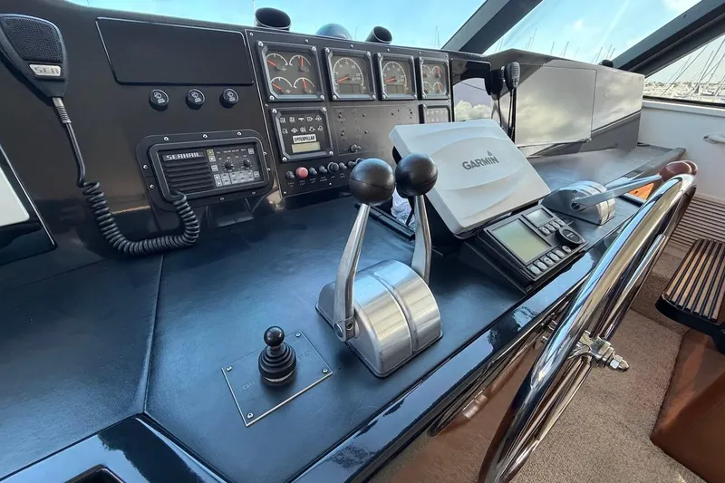 Slide: The Image of Control panel of a 1999 Viking 58 Convertible yacht with navigation equipment. - 35