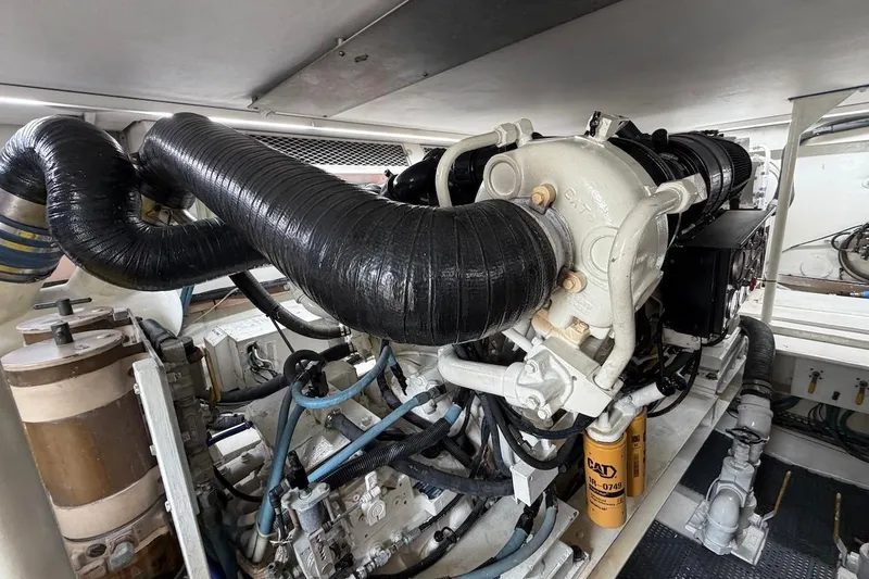 Slide: The Image of Engine room of 1999 Viking 58 Convertible yacht, featuring CAT machinery and components. - 42