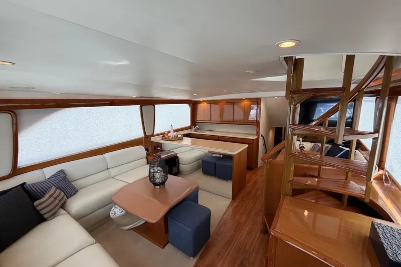 Slide: The Image of Luxurious interior of 1999 Viking 58 Convertible yacht with elegant wood finishes. - 8