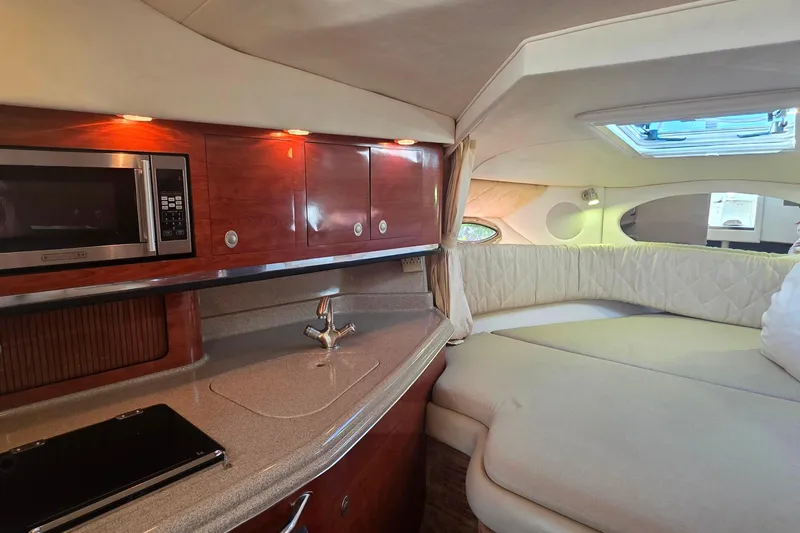 Slide: The Image of 2006 Sea Ray 290 Amberjack boat interior with seating and canopy. - 12