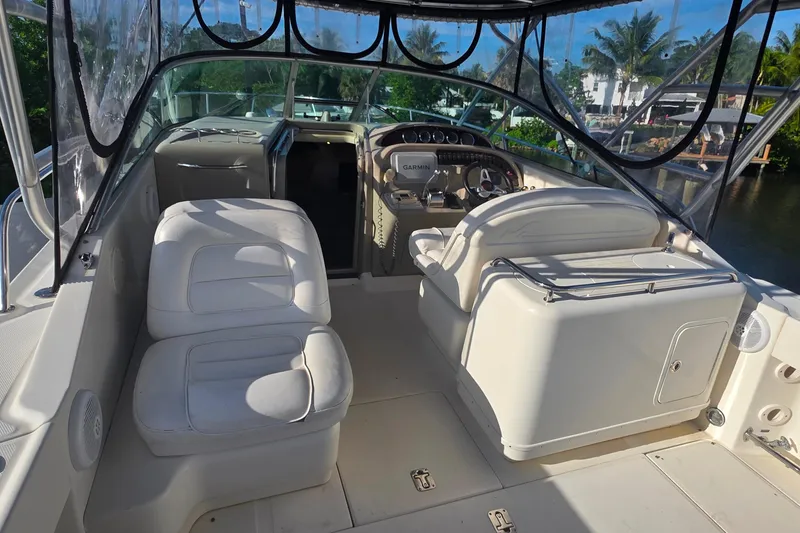 Slide: The Image of 2006 Sea Ray 290 Amberjack helm with Garmin navigation, steering wheel, and control panel. - 15