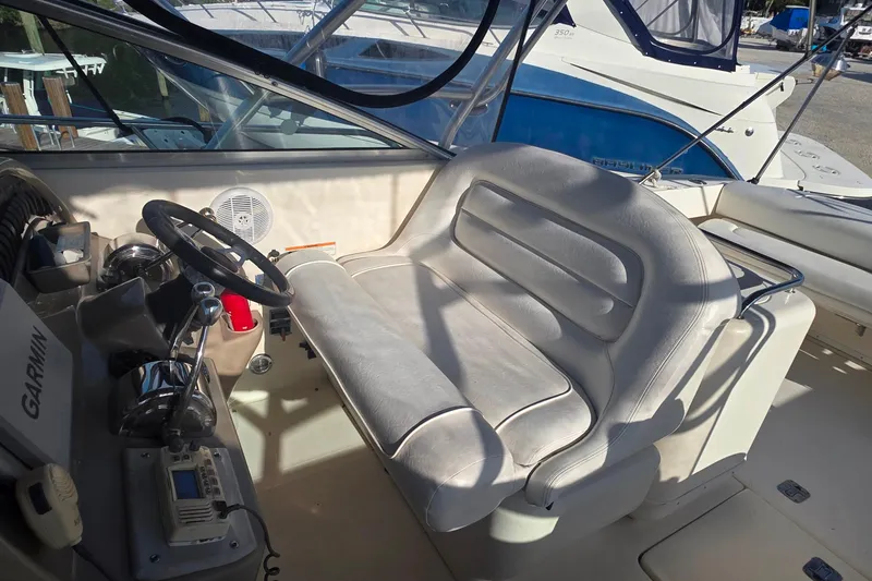 Slide: The Image of Dashboard of 2006 Sea Ray 290 Amberjack boat with gauges and controls. - 16