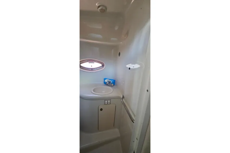 Slide: The Image of Control panel of a 2006 Sea Ray 290 Amberjack boat with various switches and gauges. - 26