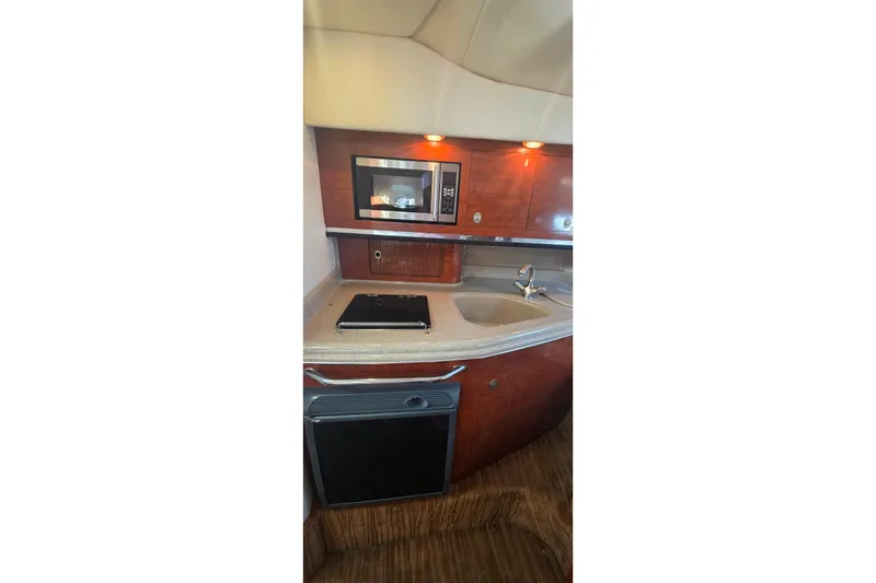 Slide: The Image of 2006 Sea Ray 290 Amberjack boat interior with helm and seating area. - 9