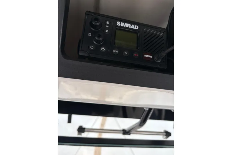 Slide: The Image of Simrad radio on 2023 Robalo R250 Center Console boat dashboard. - 18
