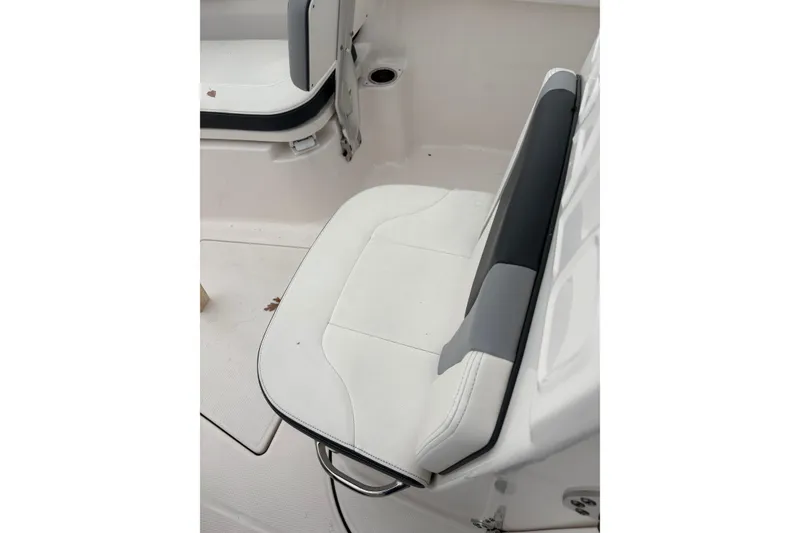 Slide: The Image of 2023 Robalo R250 Center Console boat seat, white and gray upholstery. - 20