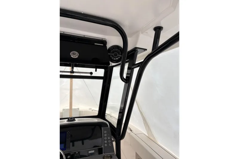 Slide: The Image of 2023 Robalo R250 Center Console interior with black frame and dashboard details. - 31