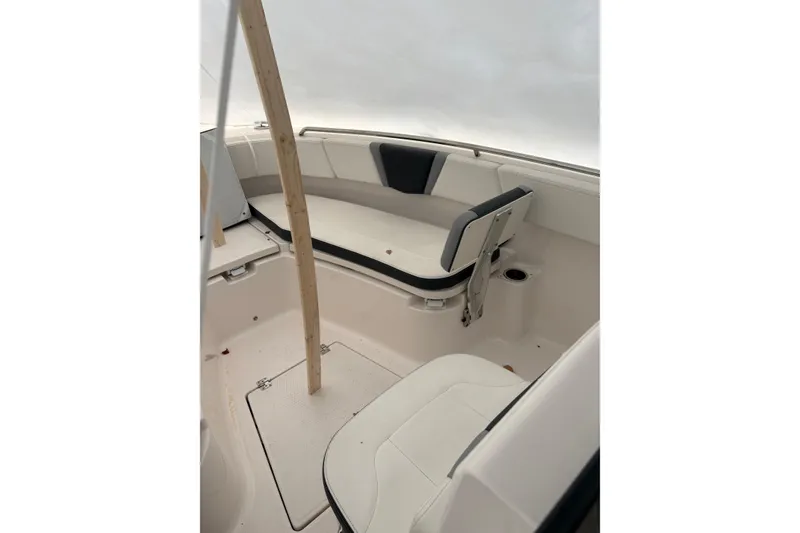 Slide: The Image of 2023 Robalo R250 Center Console boat interior with seating and storage compartments. - 33