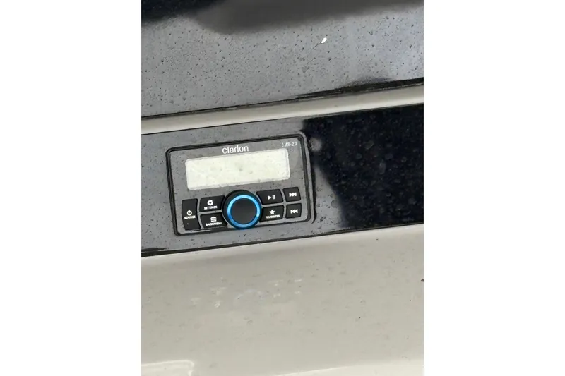 Slide: The Image of Clarion audio system on 2023 Robalo R250 Center Console boat dashboard. - 34