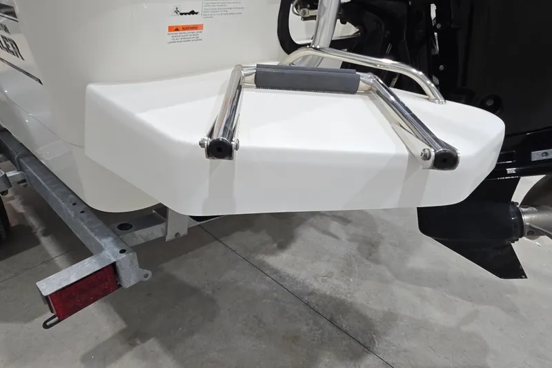 Slide: The Image of 2014 Boston Whaler 170 Montauk swim platform with ladder, shown on a trailer. - 15